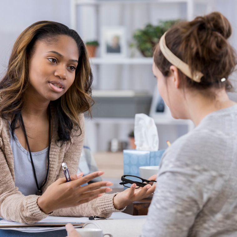 A counselor talks with a client